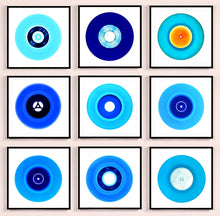 Load image into Gallery viewer, Photograph by Heidler and Heeps. A set of 9 different blue vinyls in a black frame. They are displayed in a square 3 x 3 format.