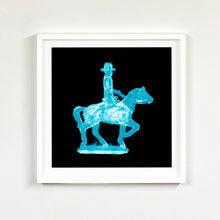 Load image into Gallery viewer, Cowboy on a horse blue pop art photographic print framed in white by Natasha Heidler