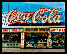 Load image into Gallery viewer, Photograph by Richard Heeps. Harry's Corner was taken on the wildwood boardwalk, featuring neon typography and the iconic Coca-Cola sign against a bright blue sky.