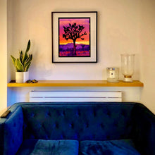 Load image into Gallery viewer, Joshua Tree Mojave Desert California sunset artwork by Richard Heeps framed in black on the living room wall