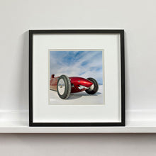 Load image into Gallery viewer, Black framed photograph by Richard Heeps.  The side on front of a red belly tank racing car, it is designed as a shark eating a $100 bill.