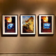 Load image into Gallery viewer, Photographs by Richard Heeps. Three photographs either end are of a retro television in a warm light showing a black and white film. The photograph in the middle is the outside steps of a motel bathed in a warm light.
