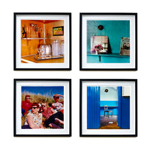 Load image into Gallery viewer, Four mounted black framed photographs by Richard Heeps. Four photographs in a retro style showing top left a Martini making drinks stations, the top right a shelf on a blue wall with a posy and a book on cats leant on it, the bottom left, four women in a 1940s style lounging on a hill and the fourth photograph through a door looking in on a lone chair in a blue room.