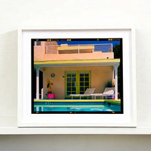 Load image into Gallery viewer, White framed photograph by Richard Heeps. Palm Springs Pool Side II showcases classic mid-century Palm Springs California architecture. Cool blue skies and pool with accents of pink and almost neon yellow.