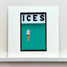 Load image into Gallery viewer, Mounted photograph by Richard Heeps.  At the top black letters spell out ICES and below is depicted a 99 icecream cone sitting left of centre against a Turquoise Teal coloured background.