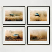 Load image into Gallery viewer, Four Black framed photographs by Richard Heeps. The four photographs are of a light blue Buick car moving and slightly obscured by the dust clouds which it has created. The car is sideways on in the first photograph, head on in the second, its back in the third and can hardly been seen in the fourth photograph.