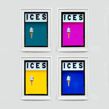 Load image into Gallery viewer, Set of four (2x2) white framed photographs by Richard Heeps.  Four identical photographs (apart from the block colour), at the top black letters spell out ICES and below is depicted a 99 icecream cone sitting left of centre set against, in turn, a blue teal, pink, yellow and blue coloured background.
