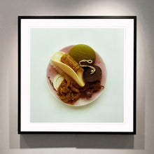 Load image into Gallery viewer, Black framed photograph by Richard Heeps. A vintage pink soap dish sits on a white surface. Looking down onto the soap dish which contains two plugs, green soap, nail brush, cork and a sponge/wire wool combo.