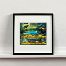 Load image into Gallery viewer, Black mounted photograph by Richard Heeps. Wet market fish tank filled with blue green and yellow fish, in a Hong Kong street.