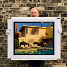 Load image into Gallery viewer, Photograph held by photographer Richard Heeps. Palm Springs Poolside, classic mid-century Palm Springs architecture, featuring cool blue skies and pool.