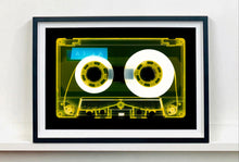 Load image into Gallery viewer, Tape Collection, 'AILA Tinted Yellow'. The Heidler & Heeps collaborations are creative representations of Natasha Heidler and Richard Heeps’ personal past, and their personalities. Tapes are significant in both their lives and the work here is made from their own collections. Their unique process makes these artworks not inanimate objects, rather they have depth, texture, grit, and they even appear to move.
