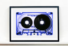 Load image into Gallery viewer, Tape Collection 'Blue Tinted Cassette'. The Heidler & Heeps collaborations are creative representations of Natasha Heidler and Richard Heeps’ personal past, and their personalities. Tapes are significant in both their lives and the work here is made from their own collections. Their unique process makes these artworks not inanimate objects, rather they have depth, texture, grit, and they even appear to move.