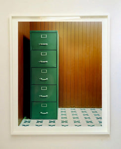 This green filing cabinet stands in the corner of a mid-century wood panelled bunker office. This interior artwork was photographed in Ho Chi Minh City, and is part of Richard's series 'This is not America'.