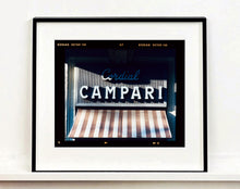 Load image into Gallery viewer, Cordial Campari, photographed as part of Richard Heeps’ series 'A Short History of Milan’ features beautiful and bold typography above the striped awning of a fascist building.
