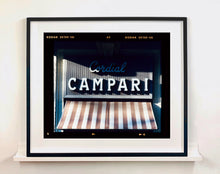 Load image into Gallery viewer, Cordial Campari, photographed as part of Richard Heeps’ series 'A Short History of Milan’ features beautiful and bold typography above the striped awning of a fascist building.