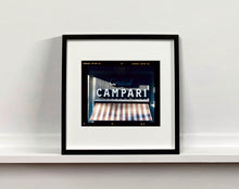 Load image into Gallery viewer, Cordial Campari, photographed as part of Richard Heeps’ series 'A Short History of Milan’ features beautiful and bold typography above the striped awning of a fascist building.