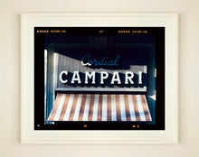 Load image into Gallery viewer, Cordial Campari, photographed as part of Richard Heeps’ series 'A Short History of Milan’ features beautiful and bold typography above the striped awning of a fascist building.
