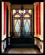 Load image into Gallery viewer, &#39;Foyer VII&#39; shows an Art Deco entrance hall in Milan, featuring stained glass panelling and marble flooring. This artwork is part of Richard Heeps&#39; series &#39;A Short History of Milan&#39;, which began in November 2018 for a special project featuring at the Affordable Art Fair Milan 2019, and the series is ongoing. There is a reoccurring linear, structural theme throughout the series, capturing the Milanese use of materials in design such as glass, metal, wood and stone.