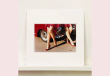 Load image into Gallery viewer, 'Glamour Cabs', photographed by Richard Heeps at the glamorous retro event Goodwood Revival. It perfectly captures elegant feminine sophistication with a vintage vibe, a nod to the film Carry on Cabbie. This artwork featured in Richard Heeps' 2018-2019 exhibition WEMEN, at Nhow Hotel Milan.