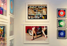 Load image into Gallery viewer, 'Glamour Cabs', photographed by Richard Heeps at the glamorous retro event Goodwood Revival. It perfectly captures elegant feminine sophistication with a vintage vibe, a nod to the film Carry on Cabbie. This artwork featured in Richard Heeps' 2018-2019 exhibition WEMEN, at Nhow Hotel Milan.