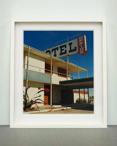 'North Shore Motel Office II' from Richard Heeps' 'Salton Sea' series. This artwork shows a deep blue sky over this Californian classic mid-century modern Americana Motel exterior. This photograph was captured by Richard Heeps in 2003 but only executed in his darkroom for the first time in Spring 2020.