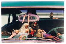 Load image into Gallery viewer, 'Oldsmobile & Sinful Barbie's' photographed in, Las Vegas, Nevada, is part of Richard Heeps 'Man's Ruin' Series. This artwork makes up the three piece sequence: 'Wendy Flamin' Eyeball', 'Wendy Resting' & 'Oldsmobile and Sinful Barbie's' shot at the Rockabilly Weekender, Viva Las Vegas. Here this is a brilliantly adult version of the iconic Barbie Doll on the dashboard of a classic American Car.