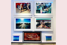 Load image into Gallery viewer, 'Oldsmobile & Sinful Barbie's' photographed in, Las Vegas, Nevada, is part of Richard Heeps 'Man's Ruin' Series. This artwork makes up the three piece sequence: 'Wendy Flamin' Eyeball', 'Wendy Resting' & 'Oldsmobile and Sinful Barbie's' shot at the Rockabilly Weekender, Viva Las Vegas. Here this is a brilliantly adult version of the iconic Barbie Doll on the dashboard of a classic American Car.