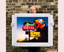 Load image into Gallery viewer, 'Lariat Motel' is a classic Richard Heeps Americana 'Sign Porn' artwork. It was captured in its original site in Fallon, Nevada. The owners since sold the Lariat Motel and donated the 1950's sign with original neon tubing to the Churchill Arts Council. This photograph forms part of Richard Heeps' 'Dream in Colour' series.