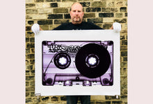 Load image into Gallery viewer, Tape Collection 'Blank Tape Side A Purple'. The Heidler & Heeps collaborations are creative representations of Natasha Heidler and Richard Heeps’ personal past, and their personalities. Tapes are significant in both their lives and the work here is made from their own collections. Their unique process makes these artworks not inanimate objects, rather they have depth, texture, grit, and they even appear to move.