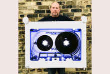 Load image into Gallery viewer, Tape Collection 'Blue Tinted Cassette'. The Heidler & Heeps collaborations are creative representations of Natasha Heidler and Richard Heeps’ personal past, and their personalities. Tapes are significant in both their lives and the work here is made from their own collections. Their unique process makes these artworks not inanimate objects, rather they have depth, texture, grit, and they even appear to move.