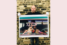 Load image into Gallery viewer, 'Oldsmobile & Sinful Barbie's' photographed in, Las Vegas, Nevada, is part of Richard Heeps 'Man's Ruin' Series. This artwork makes up the three piece sequence: 'Wendy Flamin' Eyeball', 'Wendy Resting' & 'Oldsmobile and Sinful Barbie's' shot at the Rockabilly Weekender, Viva Las Vegas. Here this is a brilliantly adult version of the iconic Barbie Doll on the dashboard of a classic American Car.