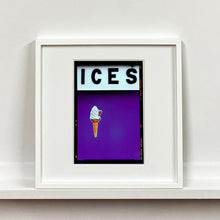 Load image into Gallery viewer, White framed photograph by Richard Heeps.  At the top black letters spell out ICES and below is depicted a 99 icecream cone sitting left of centre against a purple coloured background.  