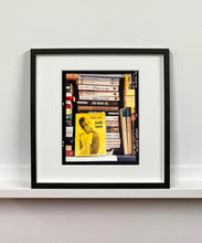 Load image into Gallery viewer, ‘Scientific Sexology’ sits amongst a stack of books, captured in Milan, Italy. 