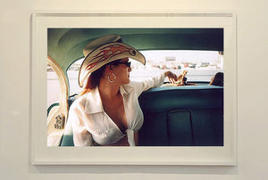 Wendy and Dolls, from Richard Heeps 'Man's Ruin' Series, this is part of a sequence of artworks capturing Wendy at the Rockabilly Weekender, Viva Las Vegas. This cinematic portrait of Wendy captures her in the back seat of her classic American Oldsmobile.