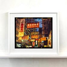 Load image into Gallery viewer, Best Choice in Downtown, Hong Kong cityscape skyline architecture street photography by Richard Heeps framed in white.