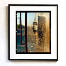 Load image into Gallery viewer, Call Box, cinematic vintage telephone booth road trip mounted photograph in a black frame from Richard Heeps Salton Sea series.