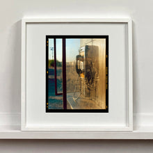 Load image into Gallery viewer, Call Box, cinematic vintage telephone booth road trip mounted photograph in a small white frame from Richard Heeps Salton Sea series.