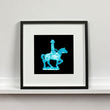 Load image into Gallery viewer, Cowboy on a horse blue pop art small photographic print framed in black by Natasha Heidler