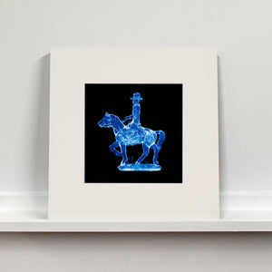 Cowboy on a horse blue pop art mounted photograph by Natasha Heidler.