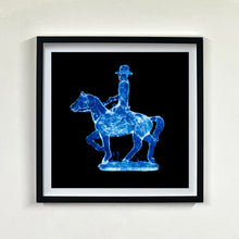 Load image into Gallery viewer, Cowboy on a horse blue pop art small black frame photograph by Natasha Heidler.