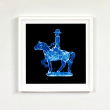 Load image into Gallery viewer, Cowboy on a horse blue pop art small white frame photograph by Natasha Heidler.