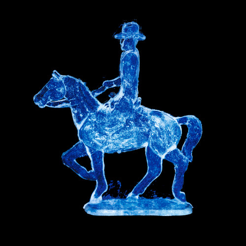 Cowboy on a horse blue pop art photograph by Natasha Heidler.