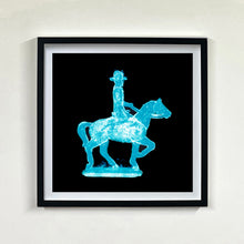 Load image into Gallery viewer, Cowboy on a horse blue pop art photographic print framed in black by Natasha Heidler