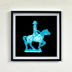 Cowboy on a horse blue pop art photographic print framed in black by Natasha Heidler