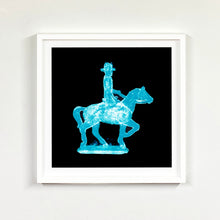 Load image into Gallery viewer, Cowboy on a horse blue pop art photographic print framed in white by Natasha Heidler