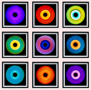 Photograph by Heidler and Heeps. 9 colourful vinyl records in black frames organised in a 3 x 3 square formation.