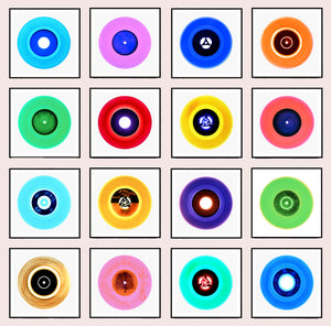 Photograph by Heidler and Heeps. 16 photographs of colourful vinyls in black frames. They are set in a 4x4 square format.