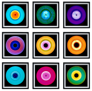 Photograph by Heidler and Heeps. Nine colourful vinyl records appearing in a 3 x 3 format.