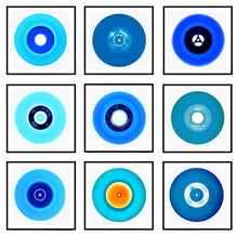 Load image into Gallery viewer, Photograph by Heidler and Heeps. A set of 9 different blue vinyls in a black frame. They are displayed in a square 3 x 3 format.