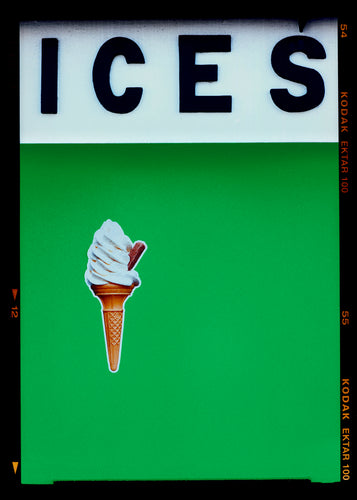 Photograph by Richard Heeps.  At the top black letters spell out ICES and below is depicted a 99 icecream cone sitting left of centre against a green coloured background.  